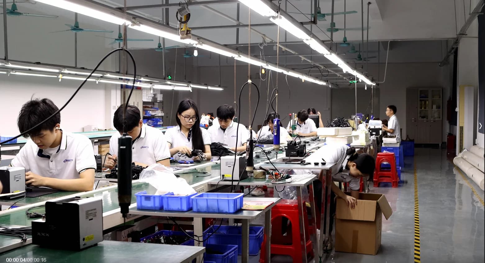 CHEETA team assembling telephone components at the Shenzhen factory