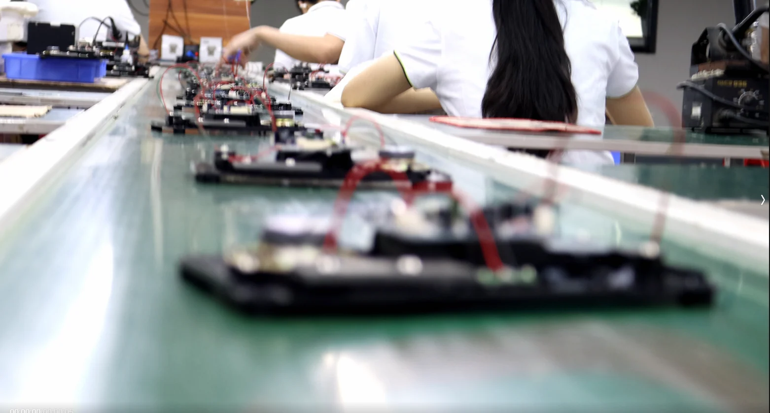 Rows of telephone bases and wired components on the CHEETA assembly line